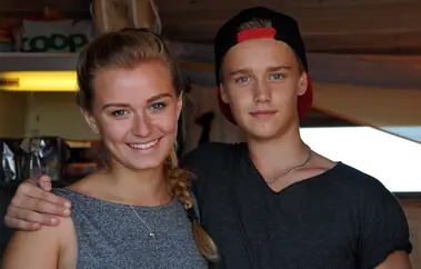 Two young summer staff inside the kiosk